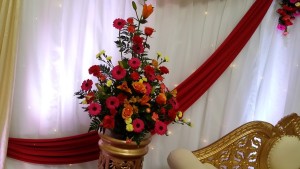 Fresh flower pedestal arrangement reds